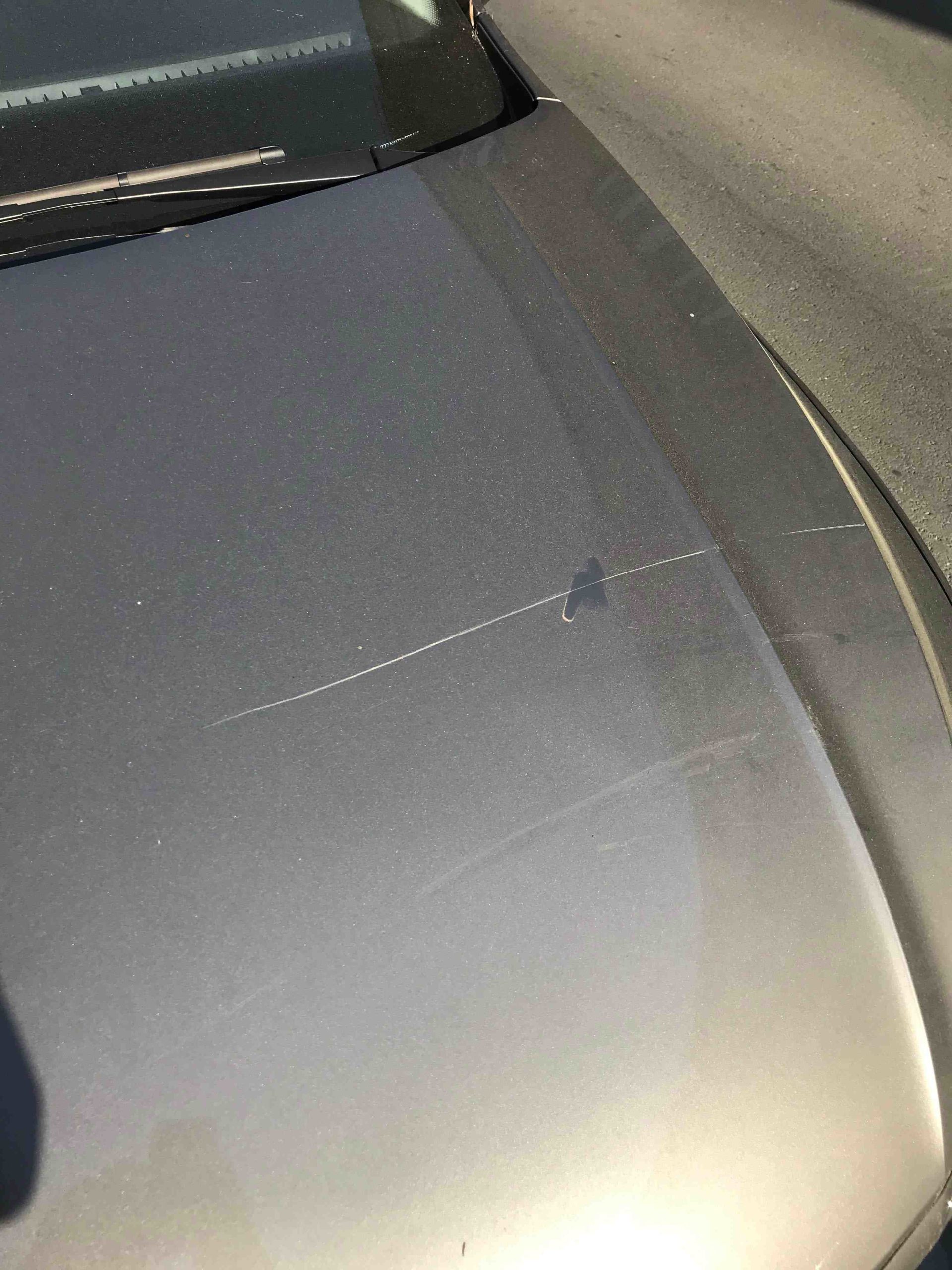 What should I do if someone scratches my car?
